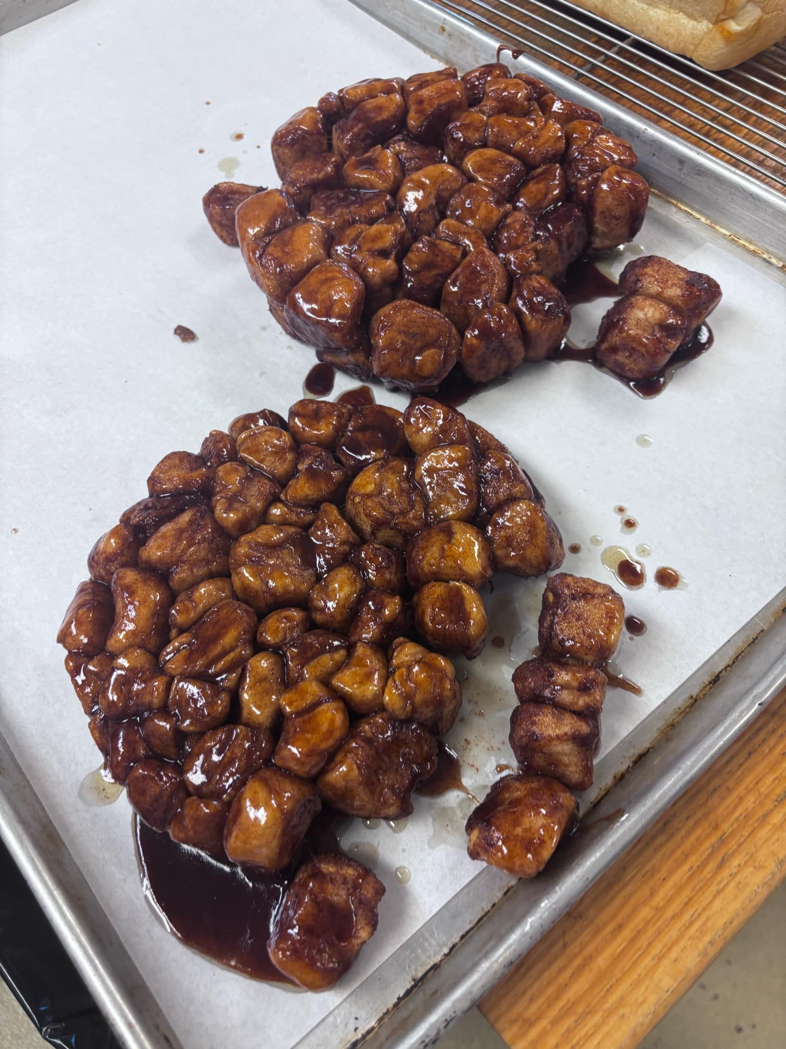 Two pull-apart monkey breads in cinnamon caramel glaze